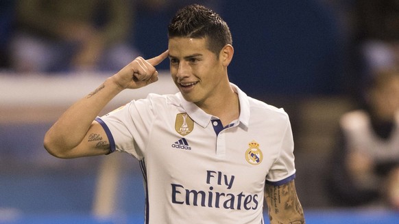 Real Madrid&#039;s James Rodriguez reacts after scoring a goal during a Spanish La Liga soccer match between Deportivo La Coruna and Real Madrid at the Riazor stadium in A Coruna, Spain, Wednesday Apr ...