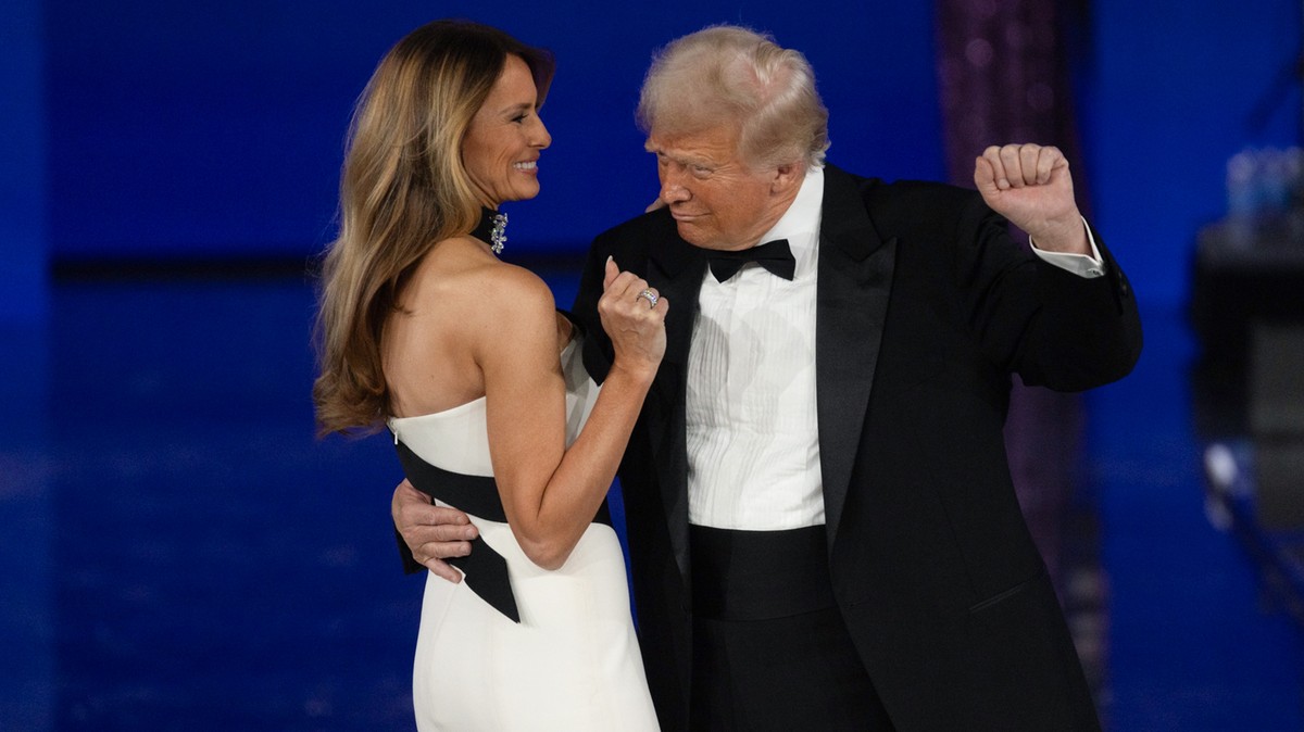 epa11841159 US President Donald Trump (R) and First Lady Melania Trump dance at the Liberty Ball, one of the events being held following US President Donald Trump's inauguration in Washington, DC ...