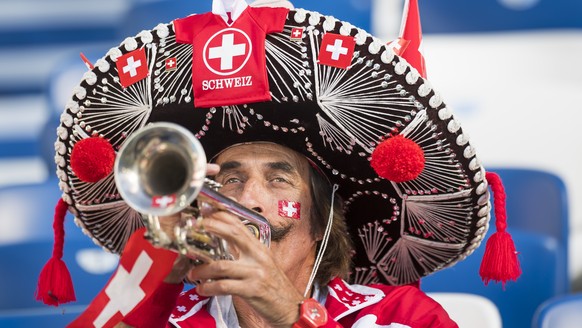 A fan from Switzerland reacts during the FIFA World Cup 2018 group E preliminary round soccer match between Switzerland and Serbia at the Arena Baltika Stadium, in Kaliningrad, Russia, Friday, June 22 ...