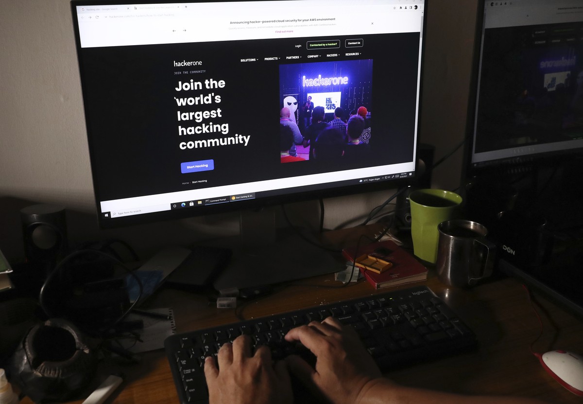 A man visits a hacker community website at a house in Jakarta, Indonesia, Monday, Sept. 20, 2021. Indonesian authorities have found no evidence that the country's main intelligence service's ...