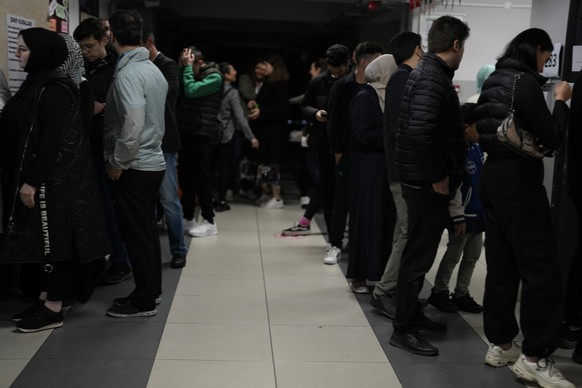 People wait to cast their ballot at a polling station in Istanbul, Turkey, Sunday, May 28, 2023. Voters in Turkey returned to the polls Sunday to decide whether the country&#039;s longtime leader stre ...