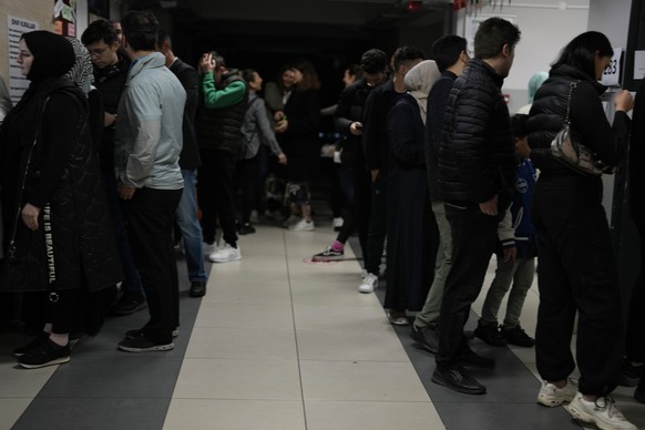 People wait to cast their ballot at a polling station in Istanbul, Turkey, Sunday, May 28, 2023. Voters in Turkey returned to the polls Sunday to decide whether the country's longtime leader stre ...