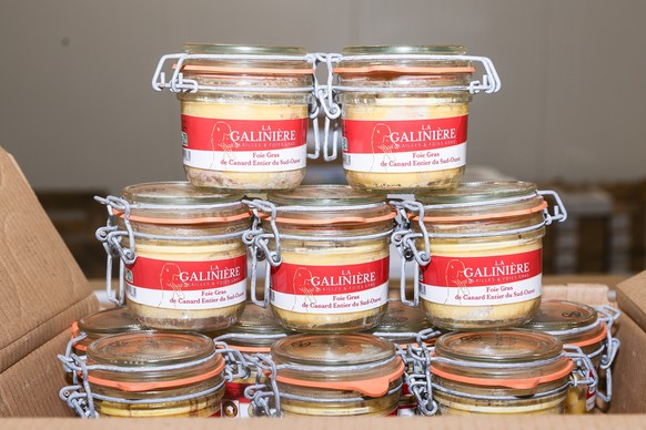 epa12582470 Several examples of duck foie gras displayed during a press visit in the poultry and meat section at the International Wholesale Food Market (MIN) in preparation for the Christmas festivit ...