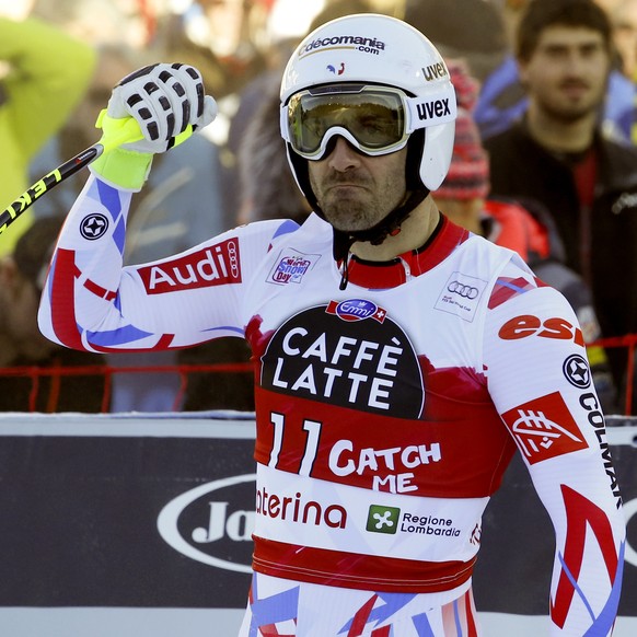 France's Adrien Theaux celebrates in the finish area after completing a men's World Cup downhill in Santa Caterina Valfurva, Italy, Tuesday, Dec. 29, 2015. (AP Photo/Alessandro Trovati)