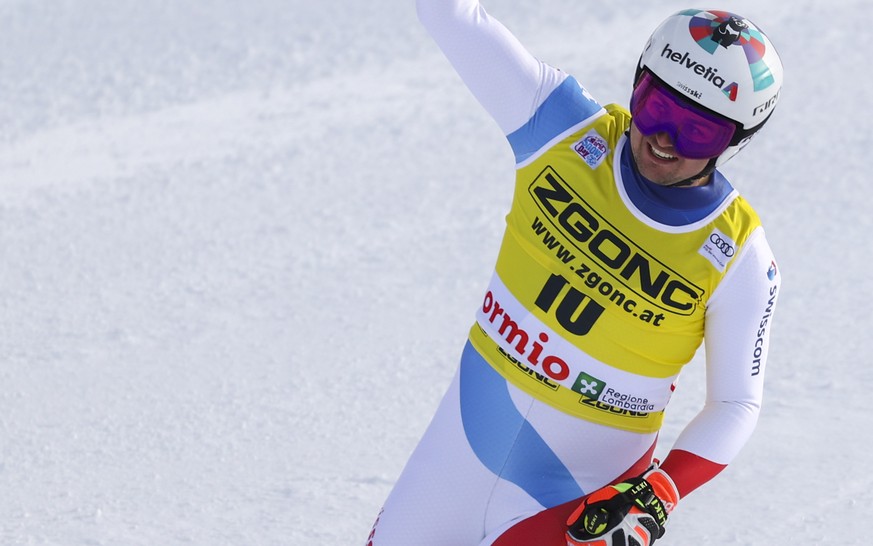 Switzerland&#039;s Urs Kryenbuehl celebrates at the finish area of an alpine ski, men&#039;s World Cup downhill, in Bormio, northern Italy, Wednesday, Dec. 30, 2020. (AP Photo/Alessandro Trovati)