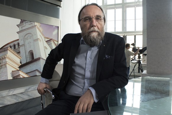 In this photo taken on Thursday, Aug. 11, 2016, Alexander Dugin, the neo-Eurasianist ideologue, sits in his TV studio in central Moscow, Russia. The Eurasian Youth Union is the youth wing of a party h ...