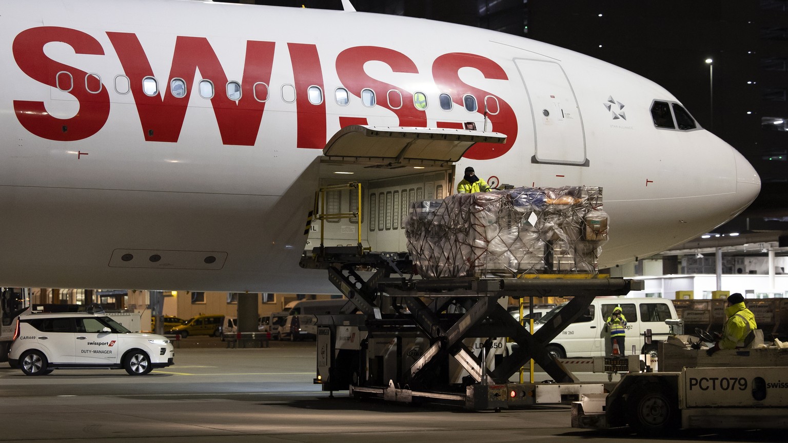 epa10451422 Workers load relief supplies of the Swiss Humanitarian Aid for the earthquake-hit Turkey onto an airplane at Zurich Airport, in Zurich, Switzerland, 06 February 2023. A powerful 7.8 magnit ...