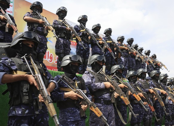 epa13117783 Houthi troopers stand guard during a protest against Saudi Arabia, in Sana'a, Yemen, 17 July 2026. Thousands of Houthi supporters demonstrated in Sana'a against Saudi Arabia a da ...