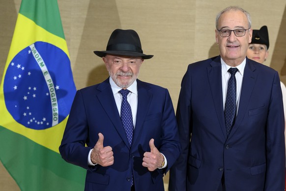 epa13038261 Swiss Federal President Guy Parmelin (R) speaks with Brazil's President Luiz Inacio Lula da Silva, prior to a bilateral meeting on the sideline of the the Evian G7 summit in Geneva, S ...
