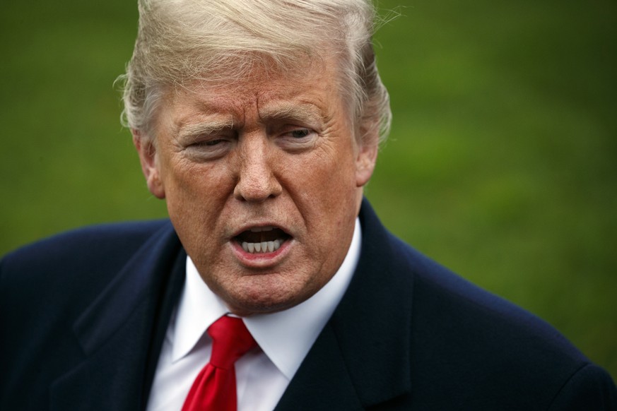 FILE- In this Nov. 26, 2018, file photo President Donald Trump speaks to members of the media before boarding Marine One on the South Lawn of the White House in Washington. According to a study in Mon ...