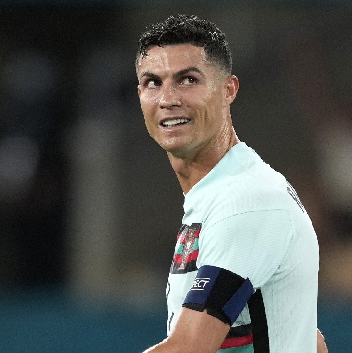 epa09306872 Portugal's player Cristiano Ronaldo reacts at the end of the UEFA EURO 2020 round of 16 soccer match between Belgium and Portugal held at La Cartuja Sevilla stadium, in Seville, Spain ...