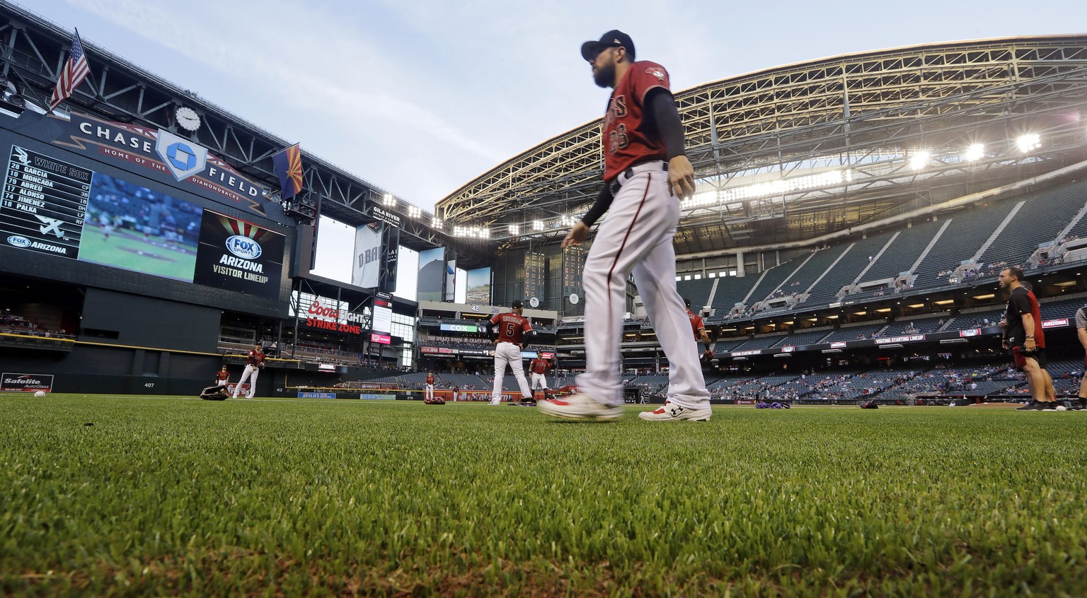 FILE - In this March 25, 2019, file photo, Arizona Diamondbacks' Steven Souza Jr. walks on new turf at the team's home field before an exhibition baseball game against the Chicago White Sox in Phoenix ...