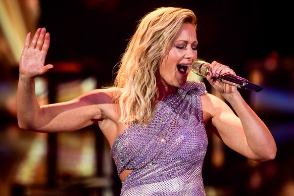 epa08865445 German singer Helene Fischer performs on stage during the &#039;Ein Herz Fuer Kinder&#039; (lit: A Heart for Children) gala show in Berlin, Germany, 05 December 2020. German television cha ...