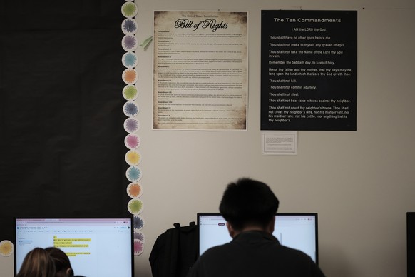 FILE - Students work under Ten Commandments and Bill of Rights posters on display in a classroom at Lehman High School in Kyle, Texas, Thursday, Oct. 16, 2025. (AP Photo/Eric Gay,File)
Ten Commandment ...