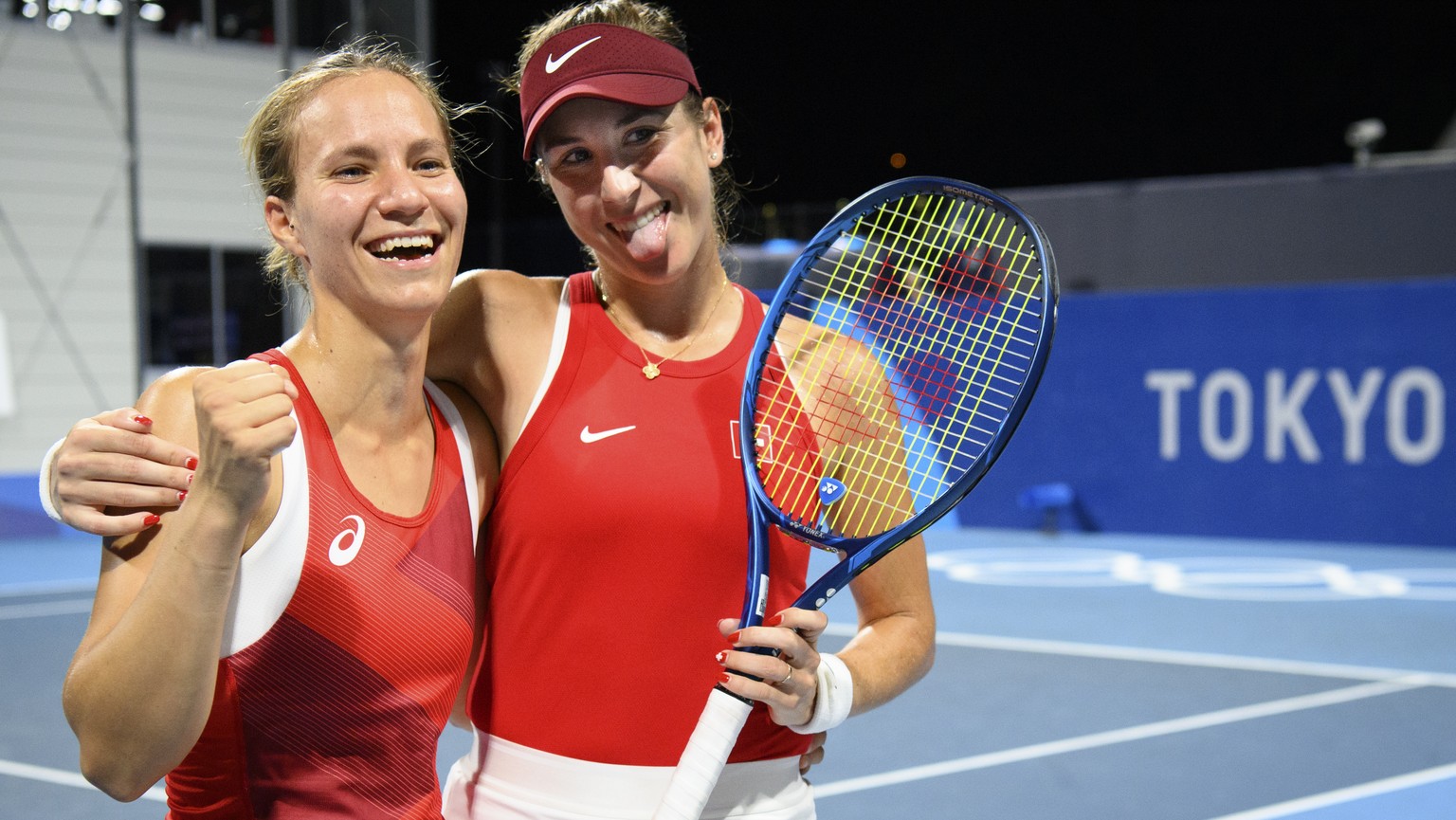 Belinda Bencic, right, and Viktorija Golubic, left, of Switzerland celebrate after winning against Laura Pigossi and Luisa Stefani of Brazil during the women&#039;s doubles tennis semifinal at the 202 ...