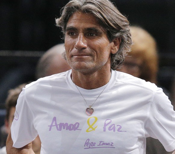 Staff member of Serbia&#039;s Novak Djokovic Spanish Pepe Imaz, wears a shirt who reads, &quot;Love and Peace&quot; as he watch the 3rd round game of the Paris Masters tennis tournament at the Bercy A ...