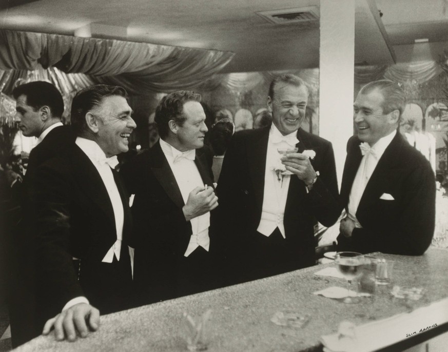 RECORD DATE NOT STATED ïSlim Aarons, Kings of Hollywood Clark Gable, Van Heflin, Gary Cooper, and James Stewart enjoy a joke at a New Year s Eve Party held at Romanoff s in Beverly Hills, 1957, gelati ...