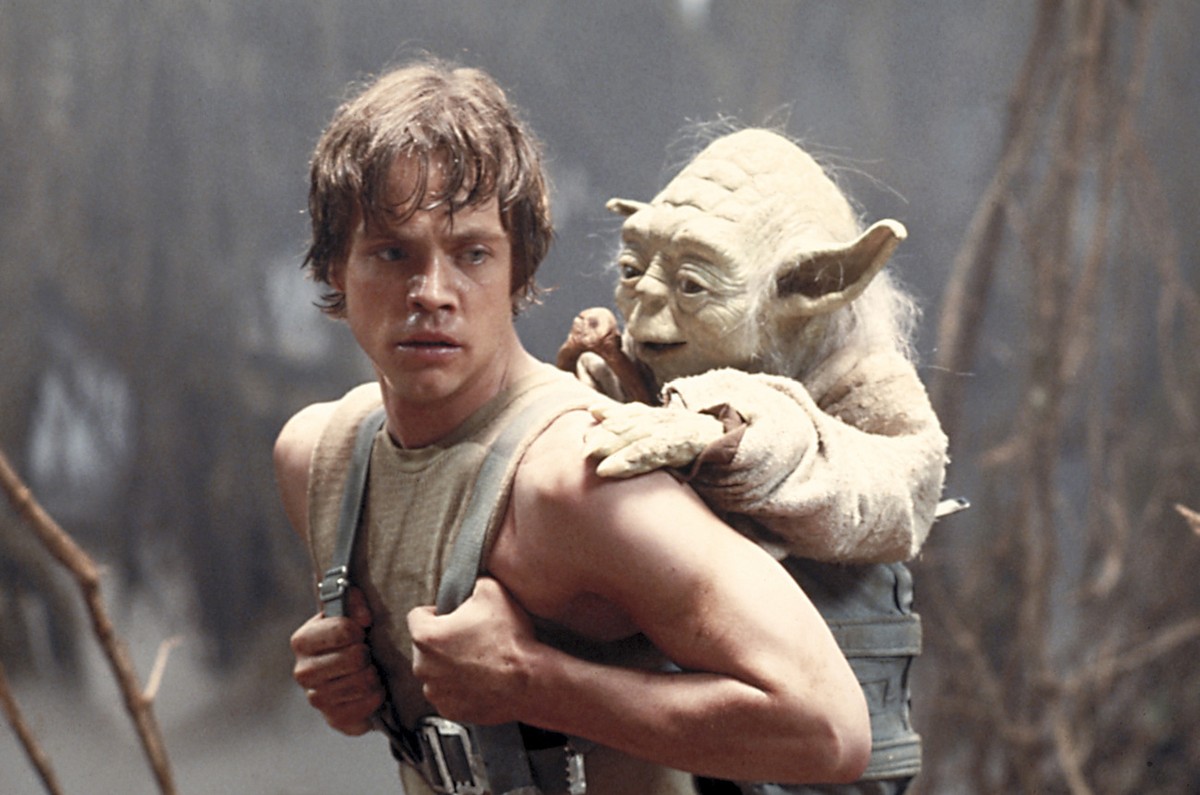 FILE - This 1980 publicity image originally released by Lucasfilm Ltd., Mark Hamill as Luke Skywalker and the character Yoda appear in this scene from "Star Wars Episode V: The Empire Strikes Bac ...