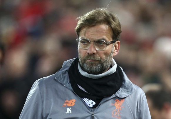 Liverpool coach Jurgen Klopp enters the field for the Champions League round of 16, second leg, soccer match between Liverpool and FC Porto at Anfield Stadium, Liverpool, England, Tuesday March 6, 201 ...