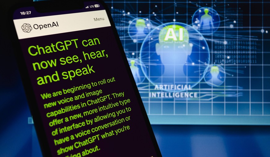 September 25, 2023, Asuncion, Paraguay: ChatGPT featured on OpenAI webpage is displayed on a smartphone backdropped by visual representation of artificial intelligence. OpenAI announced on Monday it w ...
