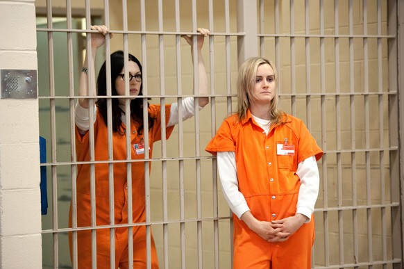 ORANGE IS THE NEW BLACK, from left: Laura Prepon, Taylor Schilling, Thirsty Bird , Season 2, ep. 201, aired June 6, 2014. photo: JoJo Whilden / Netflix / courtesy Everett Collection Netflix/Courtesy E ...
