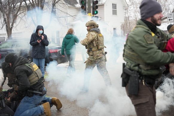 Tear gas is deployed as Federal agents make arrests on Wednesday, Jan. 21, 2026, in Minneapolis. (AP Photo/Angelina Katsanis)
Immigration Enforcement Minnesota