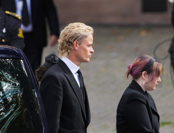epa13224674 Guests, including Marius Borg Hoiby (L) and Durek Verrett (R) arrive at Oslo Cathedral before the bier with the coffin of Norway's King Harald V arrives from the Palace to Oslo Cathed ...