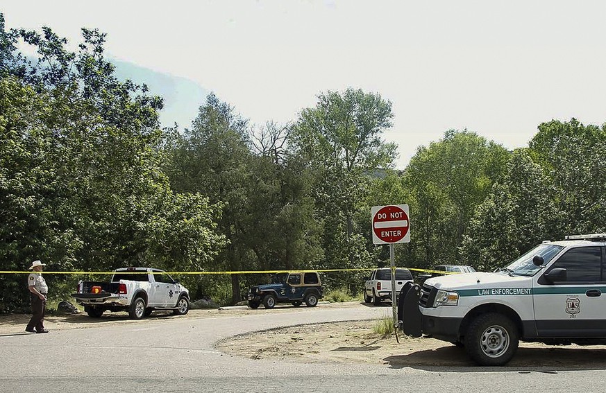 The Water Wheel Campground parking lot is blocked off by authorities Sunday, July 16, 2017, in the Tonto National Forest, Ariz., after a deadly flash-flooding hit Saturday afternoon at Cold Springs ca ...