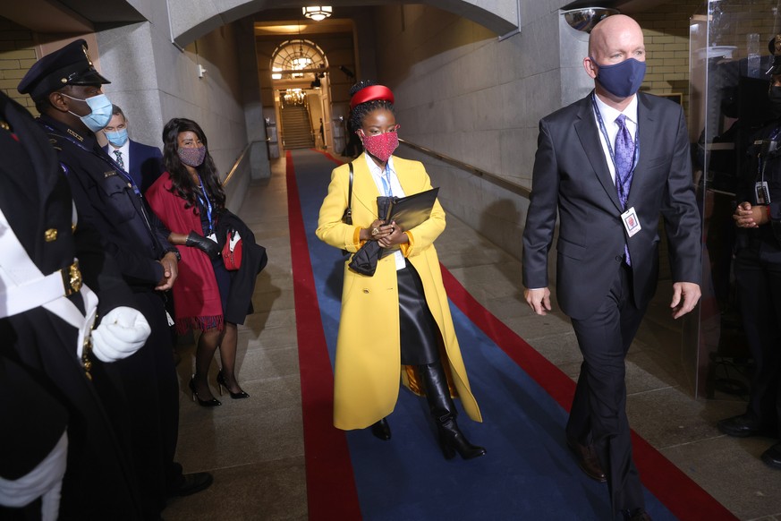 epa08953726 National youth poet laureate Amanda Gorman arrives during the inauguration of Joe Biden as US President in Washington, DC, USA, 20 January 2021. Biden won the 03 November 2020 election to  ...