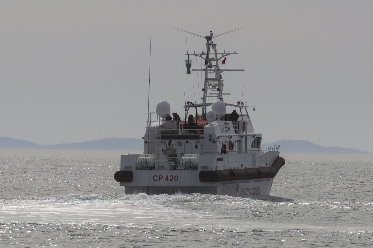 An Italian Coast Guard vessel carrying migrants from the asylum processing centers in Albania back to Italy, leaves the port of Shengjin, northwestern Albania, Saturday, Feb. 1, 2025. (AP Photo/Vlasov ...
