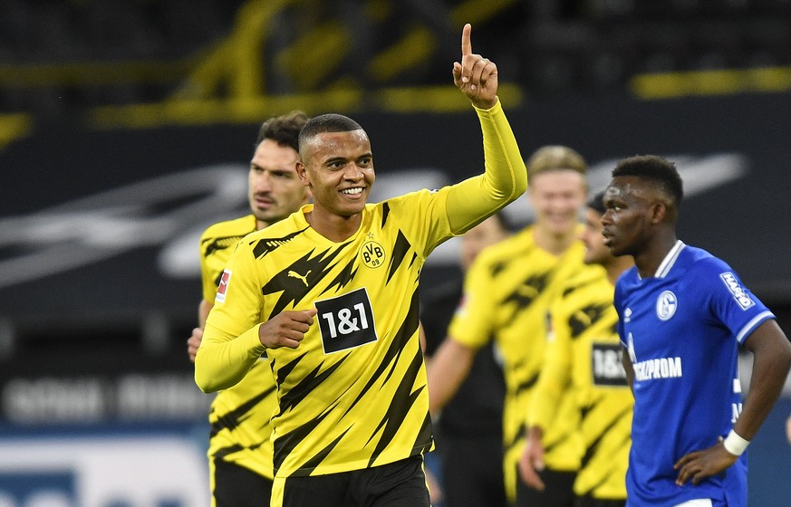 Dortmund&#039;s Manuel Akanji celebrates after he scored the opening goal during the German Bundesliga soccer match between Borussia Dortmund and FC Schalke 04 in Dortmund, Germany, Saturday, Oct. 24, ...