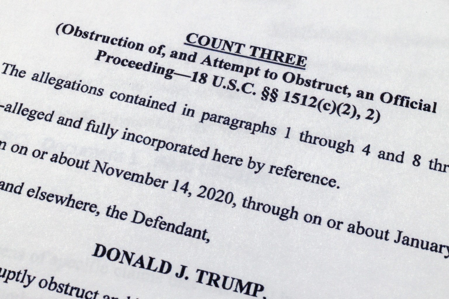 The indictment against former President Donald Trump charging him by the Justice Department for his efforts to overturn the results of the 2020 presidential election is photographed Tuesday, Aug. 1, 2 ...