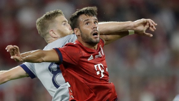 Chicago Fire&#039;s Michael DeLeeuw, background, and Bayern&#039;s Juan Bernat challenge for the ball during a farewell soccer match between FC Bayern Munich and Chicago Fire in Munich, Germany, Tuesd ...