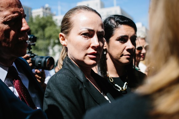 epa07798185 Chauntae Davies (C), one of deceased financier Jeffrey Epstein's alleged victims, exits the United States Federal Courthouse in New York, New York, USA, 27 August 2019. Epstein's ...