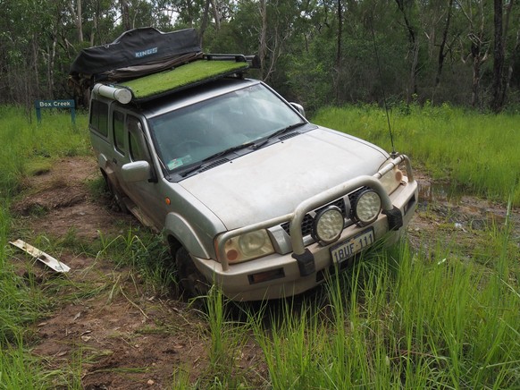 The car got stuck on a dirt road in the Oyala Thumotang National Park.