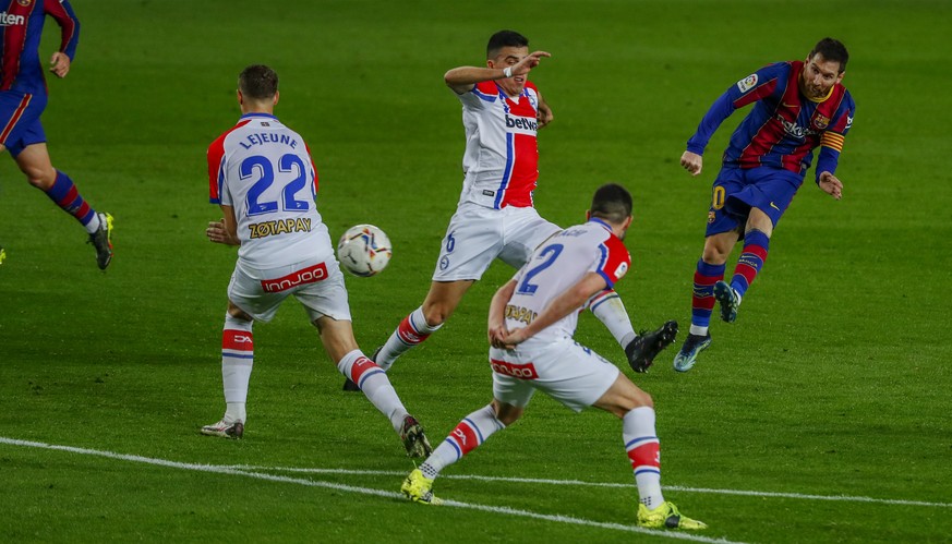 Barcelona&#039;s Lionel Messi scores his side&#039;s second goal during the Spanish La Liga soccer match between FC Barcelona and Alaves at the Camp Nou stadium in Barcelona, Spain, Saturday, Feb. 13, ...