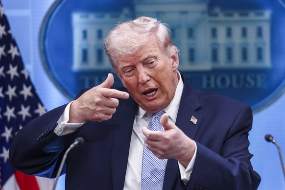 epaselect epa12872329 US President Donald Trump gestures as he responds to a question from the news media during a briefing on Iran from the White House in Washington, DC, USA, 06 April 2026. EPA/JIM  ...