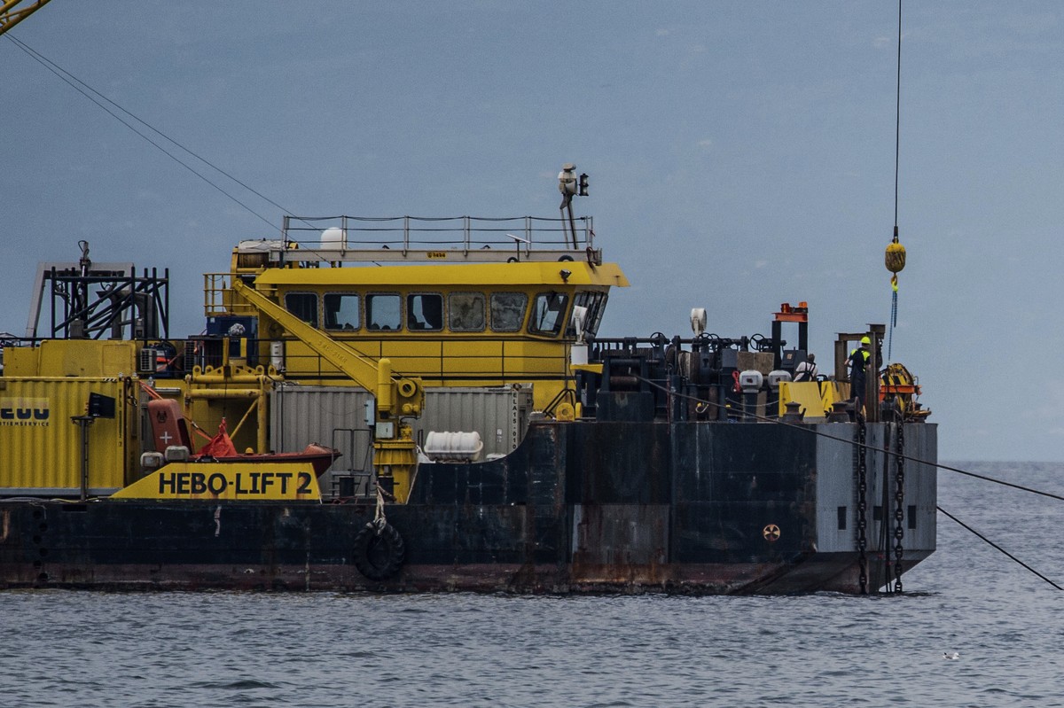 The multi-purpose floating work barge Hebo Lift 2 monitors the stretch of sea off Porticello, near Palermo, Sicily, Italy, Sunday, May 4, 2025, where the British superyacht Bayesian sunk on August 19, ...