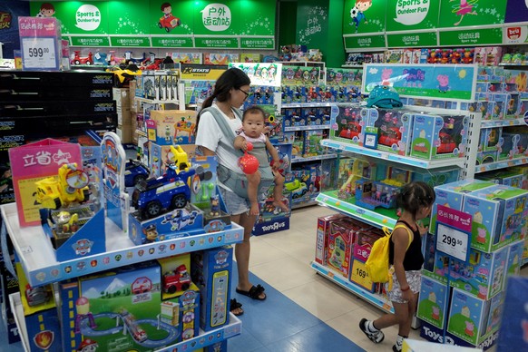 epa07775801 People look at toys at a shopping mall in Beijing, China, 16 August 2019. China has said it will retaliate against the USA if Washington imposes additional tariffs on its products on 01 Se ...