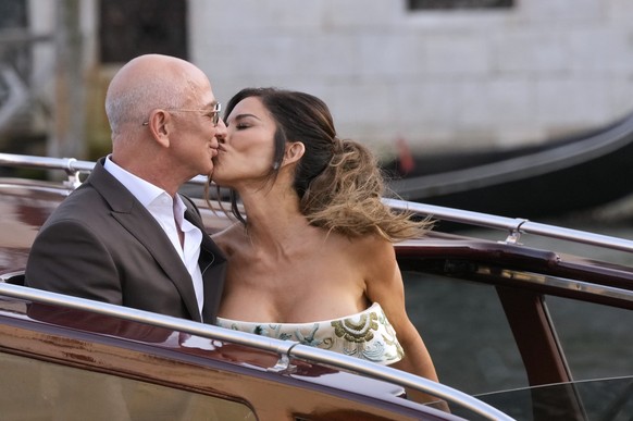 Jeff Bezos, left, and Lauren Sanchez kiss as they leave a hotel for their pre wedding reception, in Venice, Italy, Thursday, June 26, 2025. (AP Photo/Luca Bruno)
Jeff Bezos,Lauren Sanchez