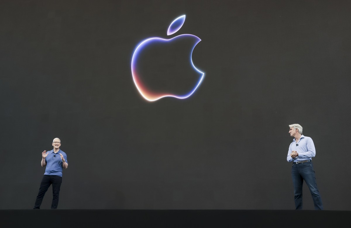 epa11402678 Apple's CEO Tim Cook (L) and Craig Federighi, Senior Vice President for Software Engineering, onstage during the 2024 Apple Worldwide Developers Conference (WWDC) on the campus of App ...
