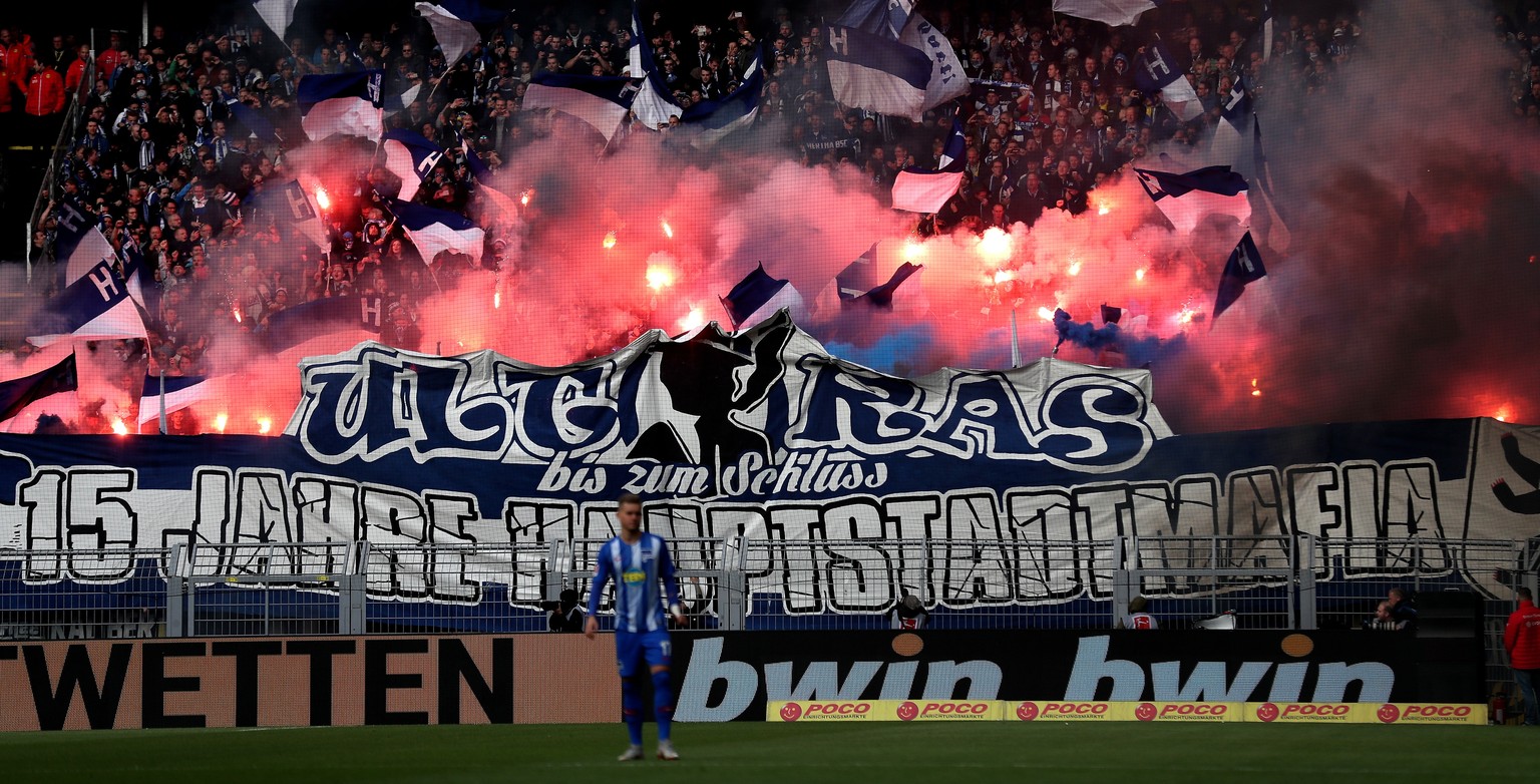 epa07124164 Hertha BSC fans light pyrotechnics during the German Bundesliga soccer match between Borussia Dortmund and Hertha BSC in Dortmund, Germany, 27 October 2018. EPA/FRIEDEMANN VOGEL CONDITIONS ...