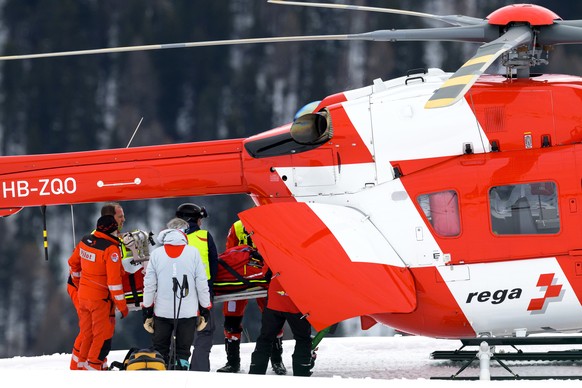 epa12584703 Michelle Gisin of Switzerland carried on a stretcher after a fall, is being airlifted by a Rega helicopter during the women's Downhill training race at the Alpine Skiing FIS Ski World ...