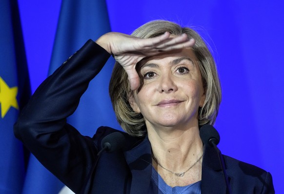 Valerie Pecresse, Conservative candidate for the French presidential election 2022, shades her face during a media conference as she presents her program in Paris, Monday, March 14, 2022. The two-roun ...