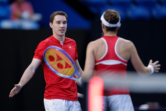 epa12622342 Belinda Bencic and Jakub Paul of Switzerland in action against Tiantsoa Rakotomanga Rajaonah and Edouard Roger-Vasselin of France during the United Cup day two doubles match between Switze ...