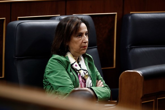 epa08302834 Spanish Defense Minister Margarita Robles listens to Prime Minister Pedro Sanchez (unseen) delivering a speech to explain the declaration of the &#039;state of alarm&#039; issued to deal w ...