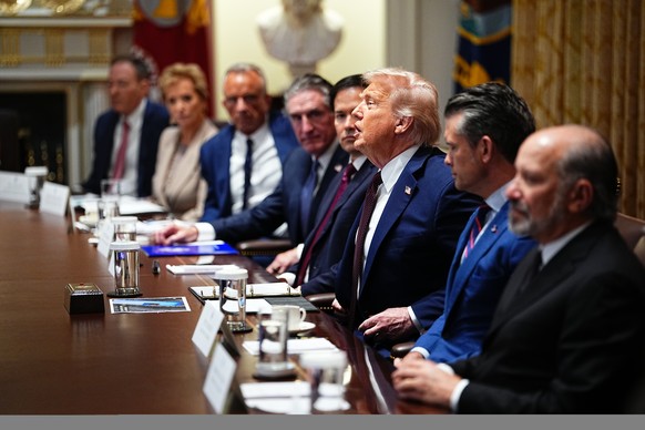 epa12324684 United States President Donald J Trump calls on a member of his Cabinet as he chairs the meeting in the Cabinet Room of the White House in Washington, DC, USA, 26 August 2025. EPA/AARON SC ...