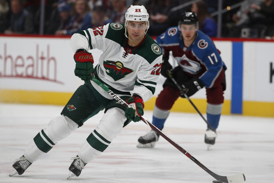 FILE - In this March 2, 2018, file photo, Minnesota Wild right wing Nino Niederreiter (22) carries the puck during the first period of an NHL hockey game in Denver. Nico Hischier is the poster boy for ...