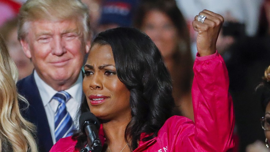 epa06940920 (FILE) - Then US Republican presidential nominee Donald J. Trump (L) participates in a campaign rally with members of the group Women for Trump with Omarosa Manigault (R) in Charlotte, Nor ...