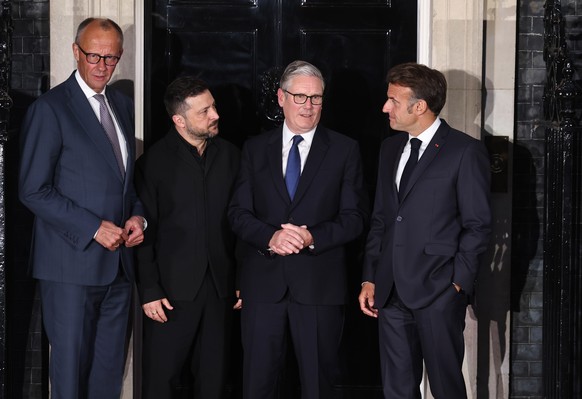 epa13023199 (L-R) German Chancellor Friedrich Merz, President of Ukraine Volodymyr Zelensky, Britain's Prime Minister Keir Starmer and French President Emmanuel Macron pose for a photograph outsi ...